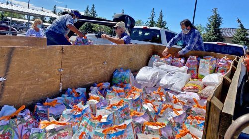 Hopis and Crossing Worlds volunteers transferring groceries and hygiene supplies to Hopi trailer at Flagstaff, July 6, 2020.