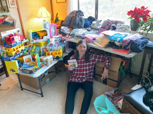 One of our volunteers organizing children's gifts she shopped for..